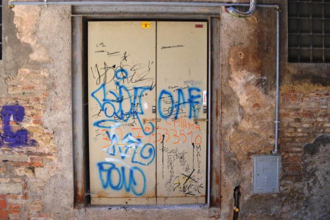 Graffiti and tags door, Citta di Castello, Umbria, Italy