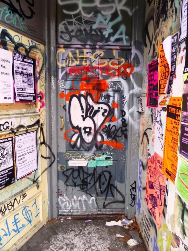 Heavily tagged door, Stokes Croft, Bristol, November 2017