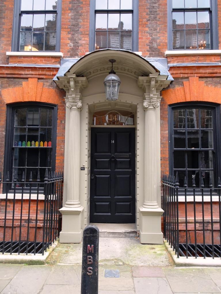 Door and swanky portico with lamp, Fournier Street, London, April 2019