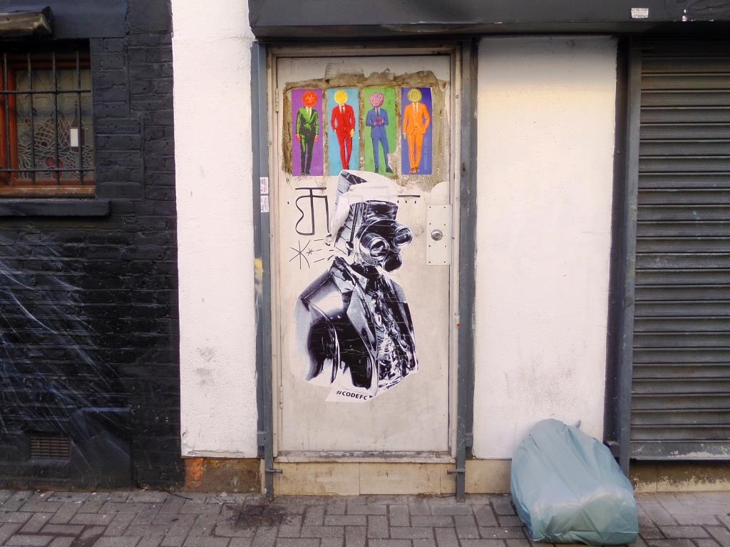 Wheatpasted door, Face the Strange (top) and CodeFC (bottom), Camden Town, November 2017