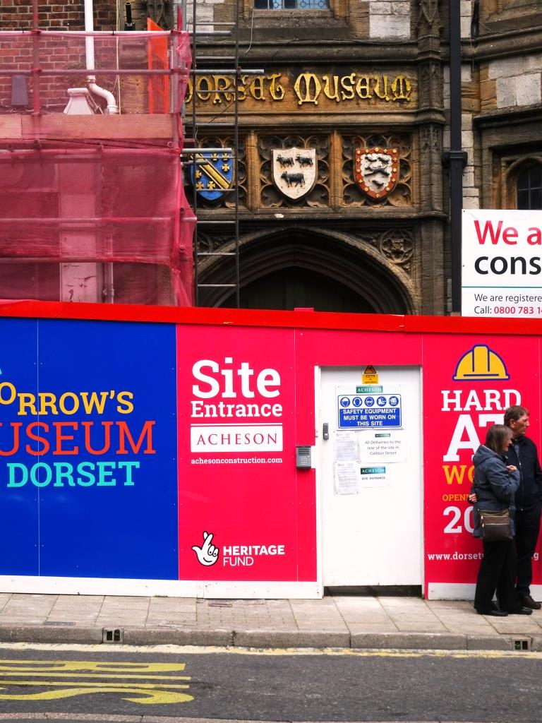 Dorset museum. Shame about the hoarding and door in front of the door. Dorchester, June 2019