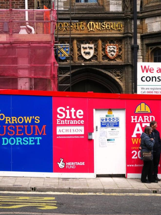 Dorset museum. Shame about the hoarding and door in front of the door. Dorchester, June 2019