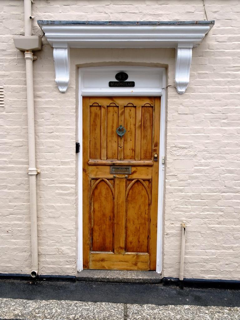Varnished wood door, Fowey, Cornwall, September 2019