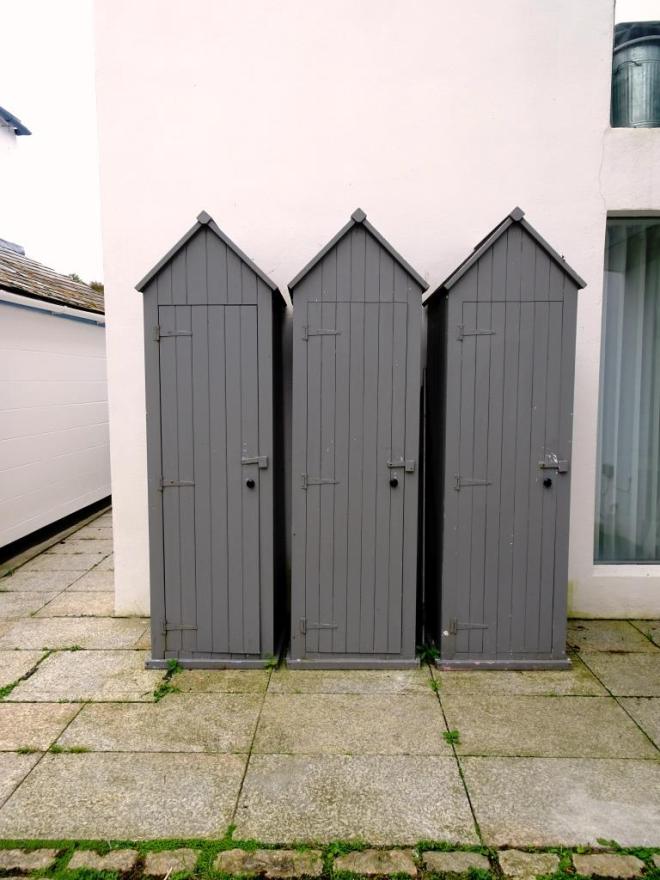 Three locker doors in a 'beach hut' style, Fowey, Cornwall, September 2019