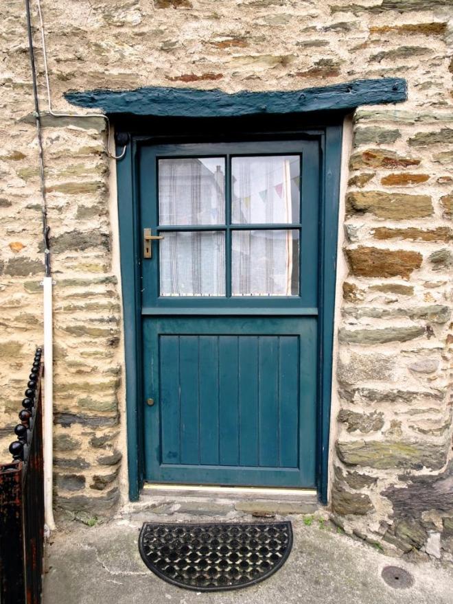 Beautiful old lintle over a stable style door, Fowey, Cornwall, September 2019