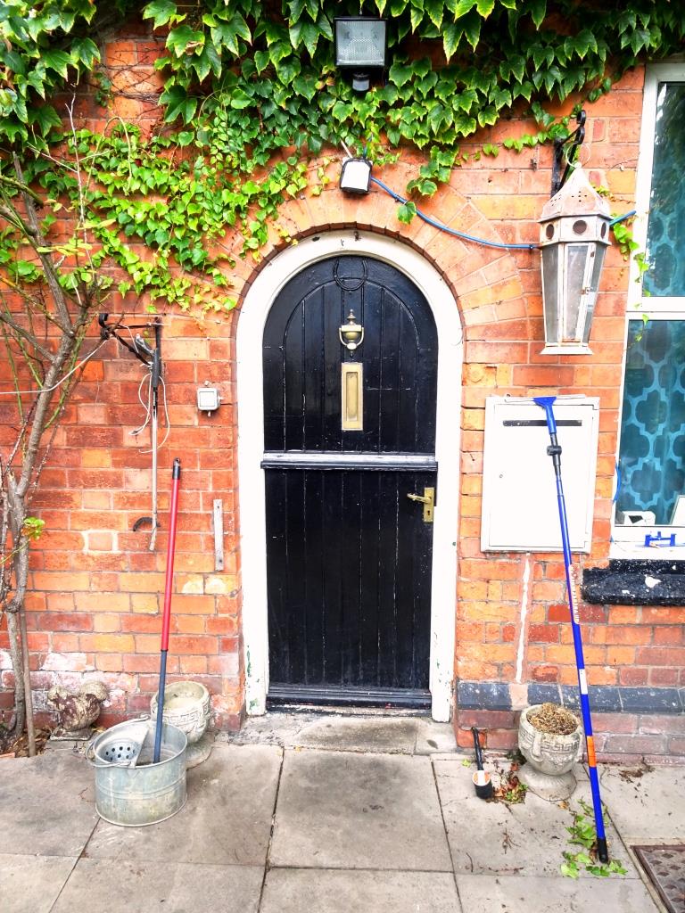Looks like chores day for the occupants behind this black split door, Cheltenham, September 2019