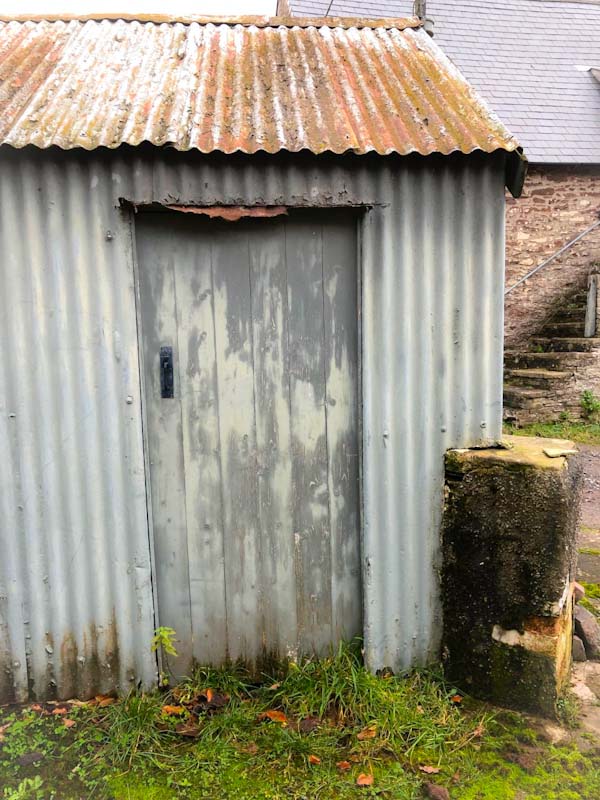 Abandoned farm house out building door, Llangorse Lake, Wales, December 2019