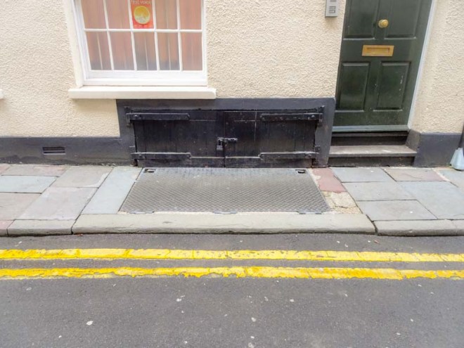 Old wooden and less old metal cellar doors, Bristol, December 2019