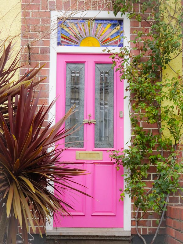 Pink door with a stained glass sun, Montpelier, Bristol, March 2020