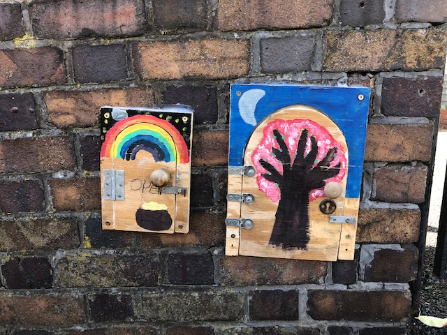 Little doors on a garden wall in Redland, Bristol, August 2020
