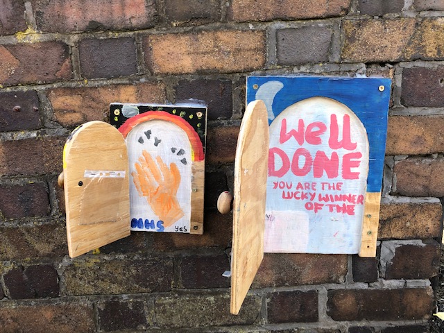 Open doors on a garden wall in Redland, Bristol, August 2020