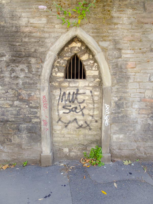 Not too sure this was ever a door, but a pretty forboding bricked in space, Easton, Bristol, July 2020 - a little bit of graffiti (nut sax) just to spice it up a litttle.