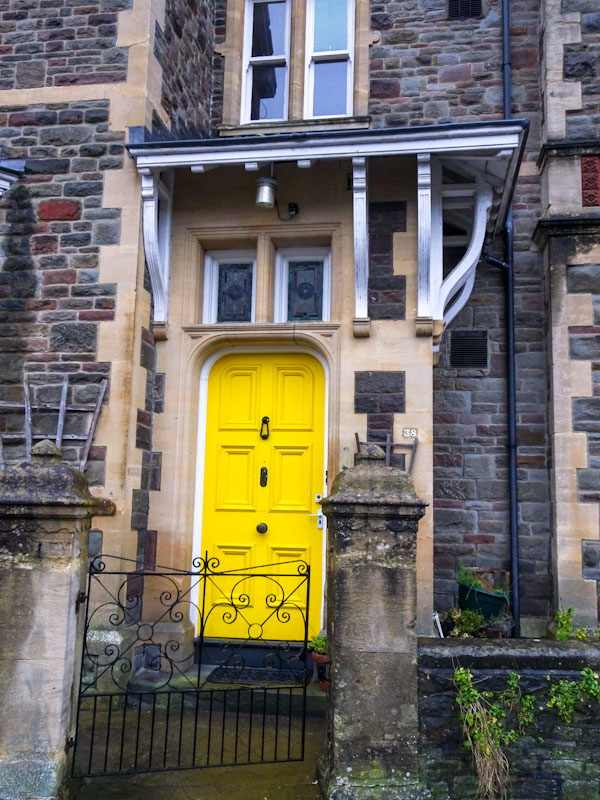 Bright yellow door with crazy awning, Redland, Bristol, December 2020