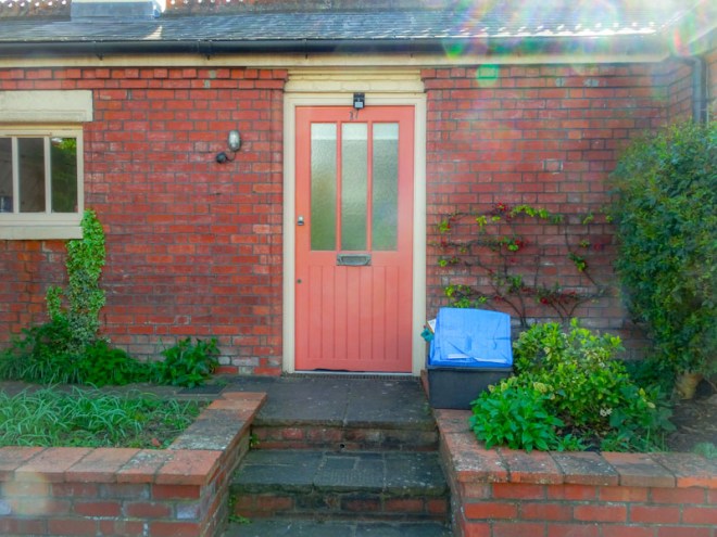 Red door with three glass panels, Bristol, April 2020
