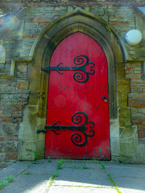 Church door with (extra) large hinges, St Agnes, Bristol, May 2020