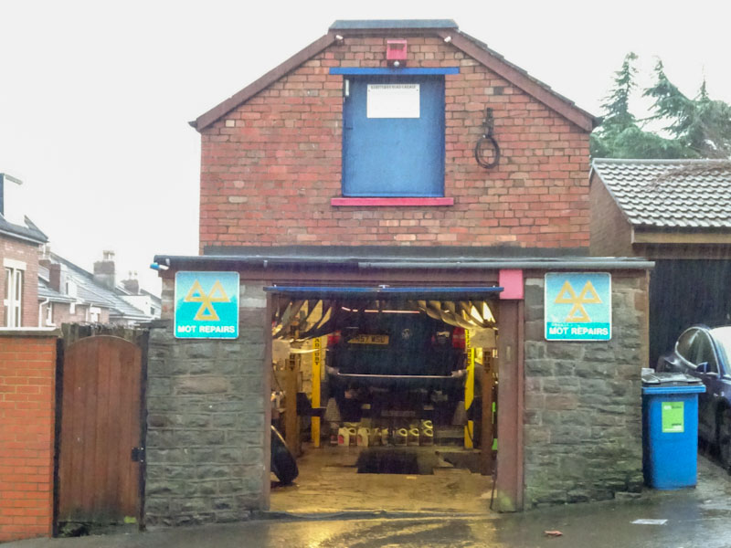MOTs here, a small garage and open door, Redland, Bristol, December 2020