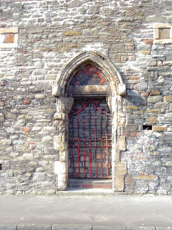 Bricked up door with the original gate intact, Bedminster, Bristol, April 2021
