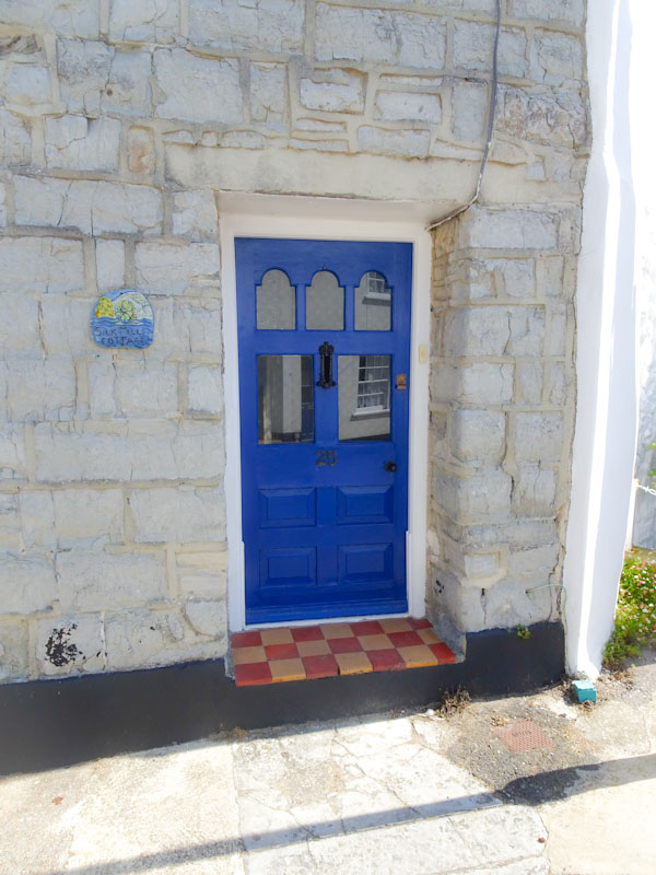 Blue door and tiled step, Lyme Regis, Dorset, July 2021