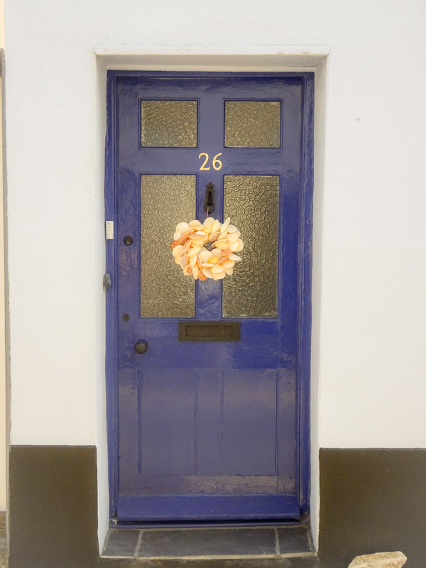 Blue door with shell wreath, Lyme Regis, Dorset, July 2021