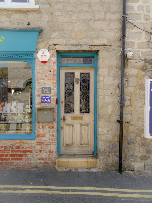 Unpainted wooden door, Lyme Regis, Dorset, August 2021