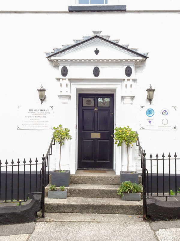 Door with grand portico, Liskeard, Cornwall, August 2021