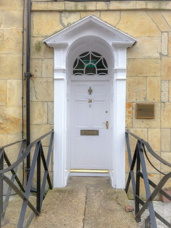 Door with nice portico and modern railings, Truro, Cornwall, August 2021