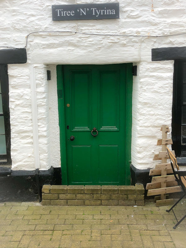 Green door - Tiree 'n' Tyrina - with brick flood defence, Looe, Cornwall, October 2021