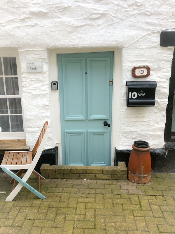Blue door - Jack's - with brick flood defence, Looe, Cornwall, October 2021