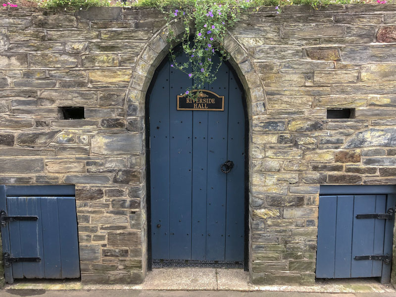 Three doors at Riverside hall, Looe, Cornwall, October 2021