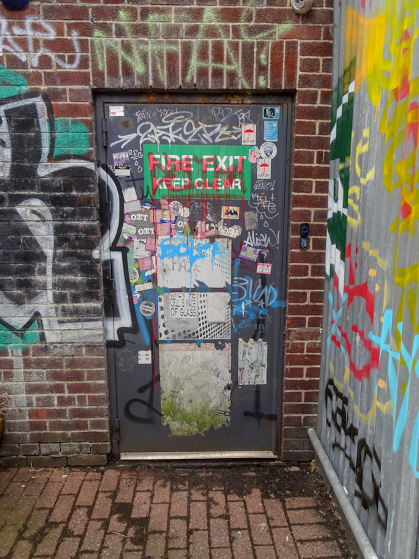 A door decorated with slaps (stickers), Bristol, May 2021