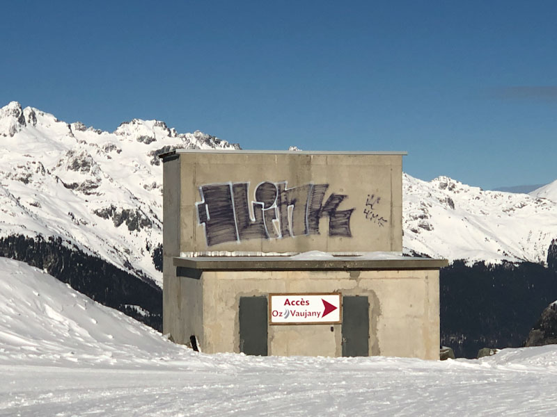 Graffiti and doors in the mountains, Alpe d'Huez, France, February 2022