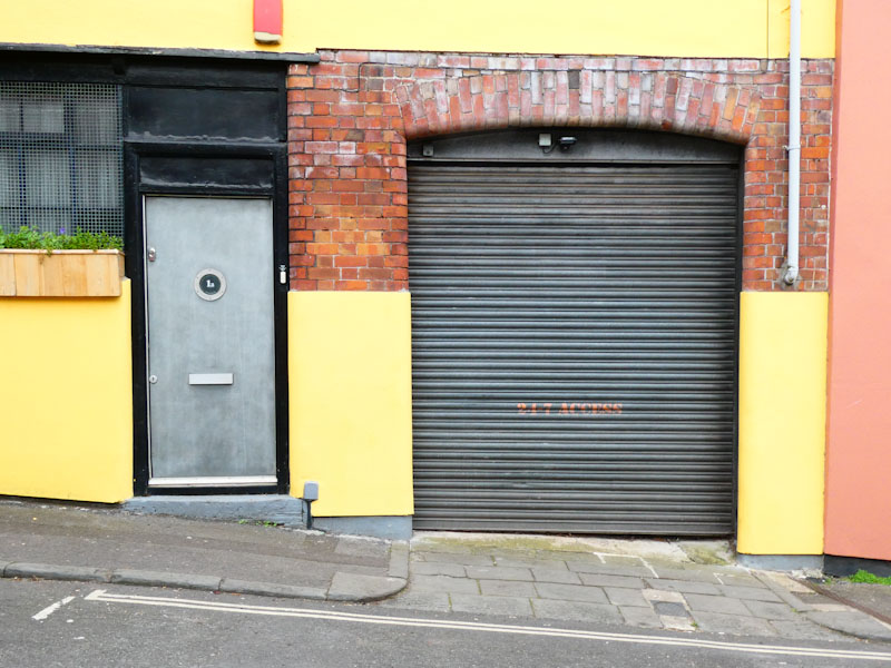 Door and shuttered garage, Montpelier, Bristol, April 2022