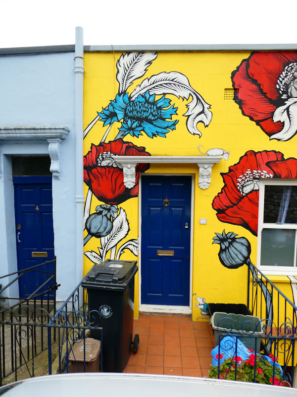 Alex Lucas artwork around a blue door, Montpelier, Bristol, April 2022
