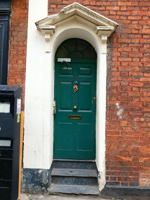 Green door with a fabulous lizard knocker, Montpelier, Bristol, April 2022
