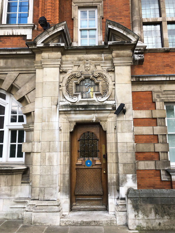 Number 3, carved wooden door with a superb masonry door surround, Westminster, London, April 2022
