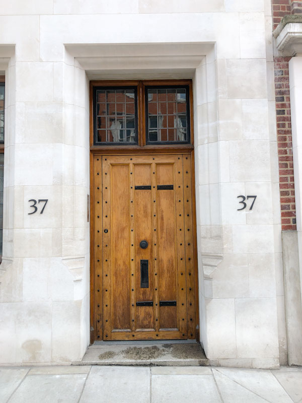 Bold wooden door and stone surround, Wesminster, London, May 2022