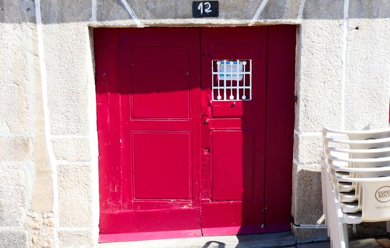 Red door on the waterfront, Porto, Portugal, June 2022