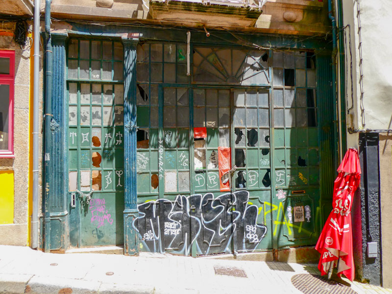 Doors on a shop front that has known better times, Porto, Portugal, June 2022