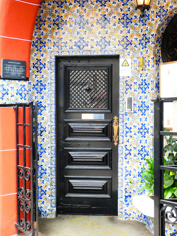Black door with tiled surround, Porto, Portugal, June 2022