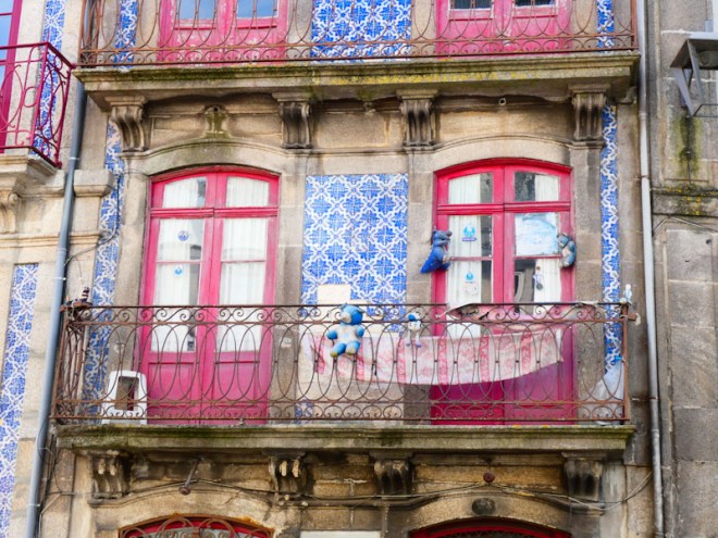 Two red balcony doors, Porto, Portugal, June 2022
