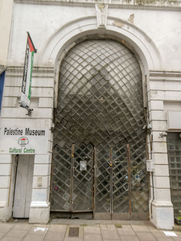Curious glass door to the Palestine Museum, Bristol, October 2022
