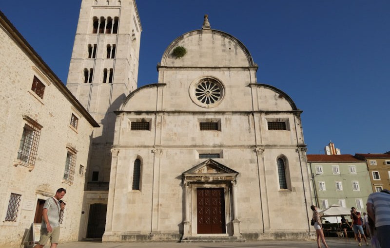 Church door with a pediment over it, Zadar, Croatia, August 2022