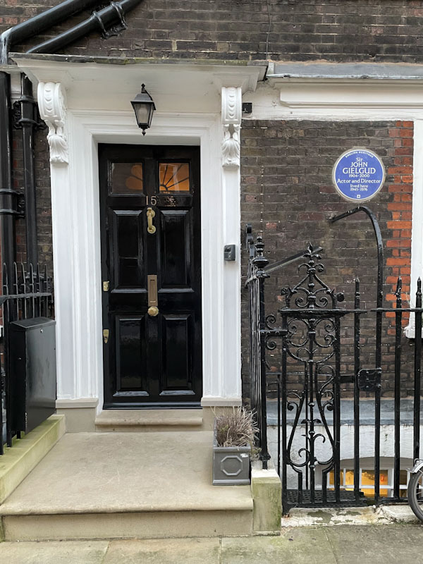 Black front door, Sir John Gielgud blue Plaque, Westminster, February 2023