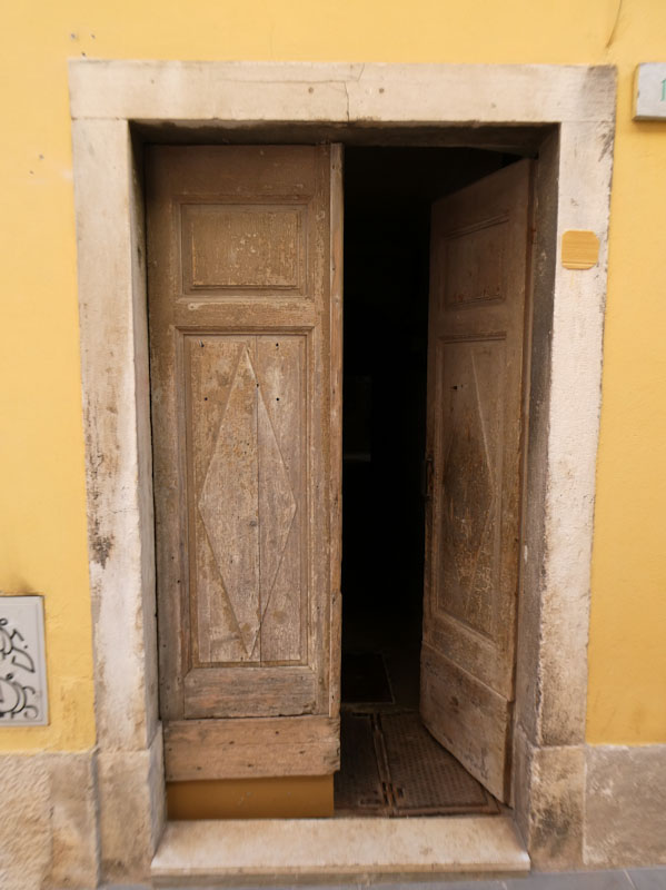 Wooden doors with diamond panels, Pula, Croatia, August 2023