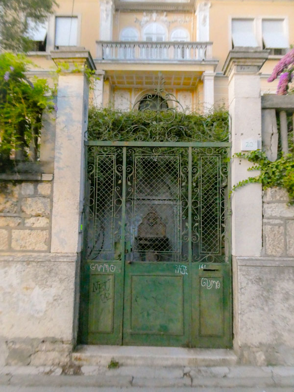 Fancy villa green gate door, Pula, Croatia, August 2022