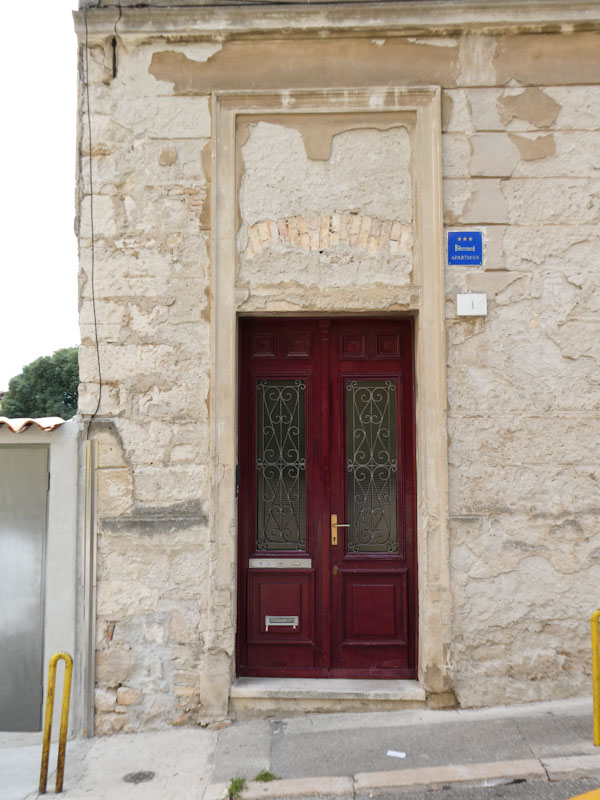 New door in a doorway with history, Pula, Croatia, August 2022