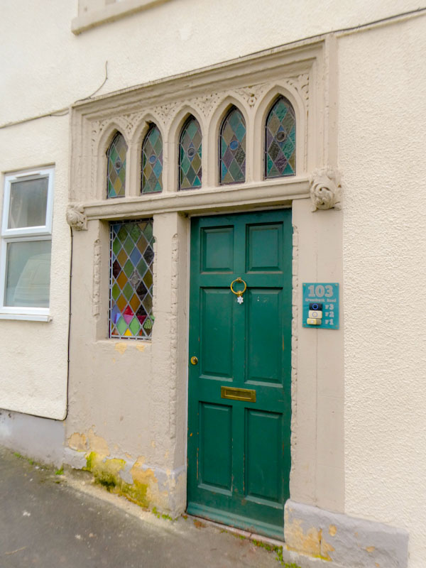 Green door and unusual windows, Greenbank, Bristol, January 2023