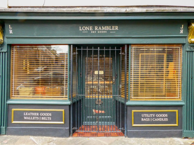 Green door behind a security gate, Lone Rambler, Bristol, May 2022