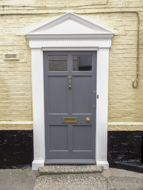 Grey door and granite step, Fowey, Cornwall, September 2019