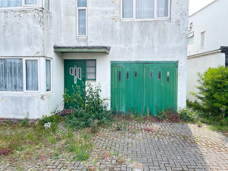 Green doors of a certain period in need of some TLC, Weston-super-Mare, May 2023